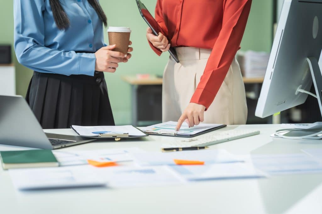 Two Asian Business Woman at a Desk
